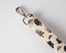 Load image into Gallery viewer, Rooted Solitude Keychain Wristlet
